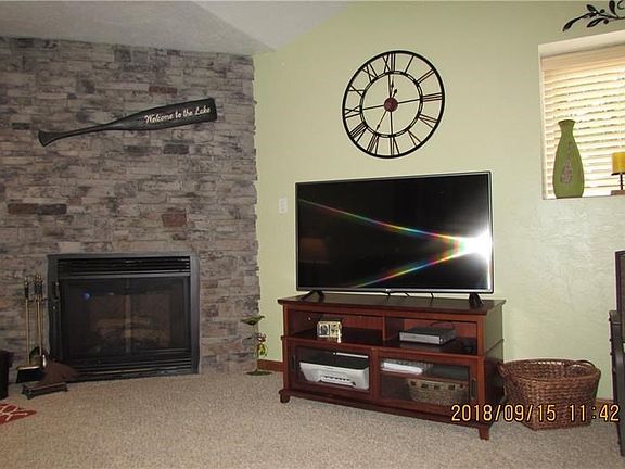 You'll love the cozy gas log fireplace with floor to ceiling stone surround.