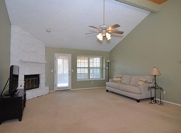 living room with vaulted ceiling