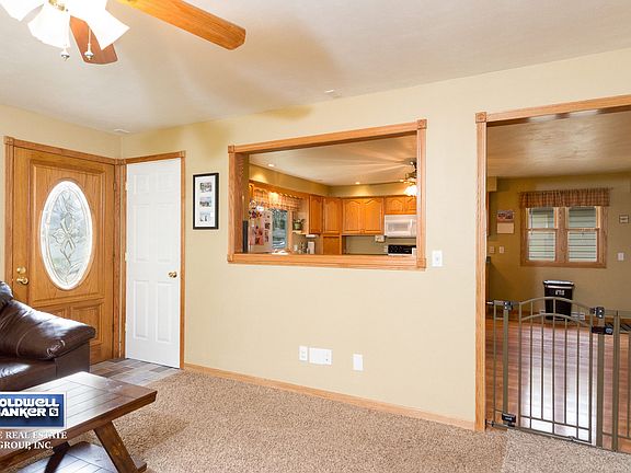 Coat Closet and Pass Thru Window to Kitchen
