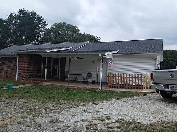 Back of house with patio