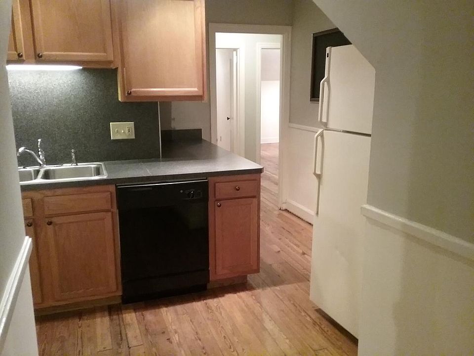 Kitchen has lots of cabinets and drawers