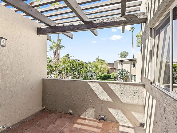 Outdoor Patio with amazing sunset views, views of green space and pool.