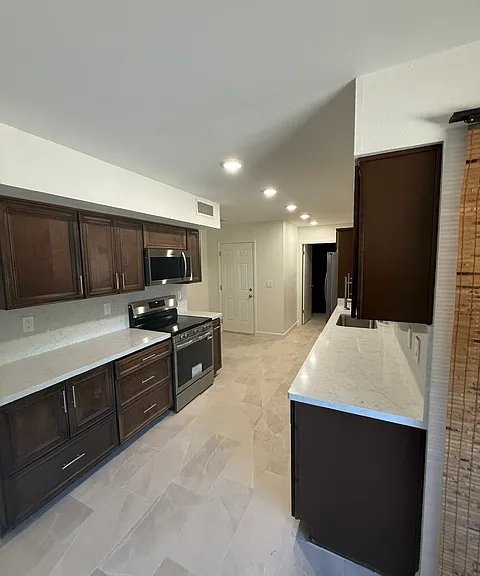 Quartz counter & backsplash with Lots of cabinets