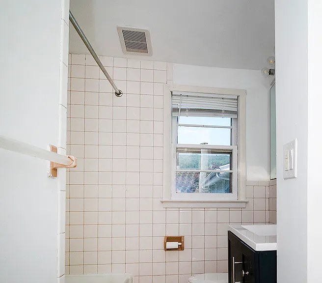 Full bathroom with skylight