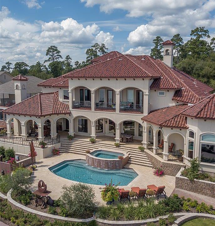 Gorgeous Mediterranean-style waterfront villa on Lake Conroe in Bentwater Subdivision.