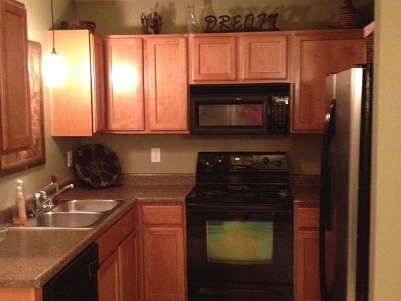 open kitchen with stainless steel fridge