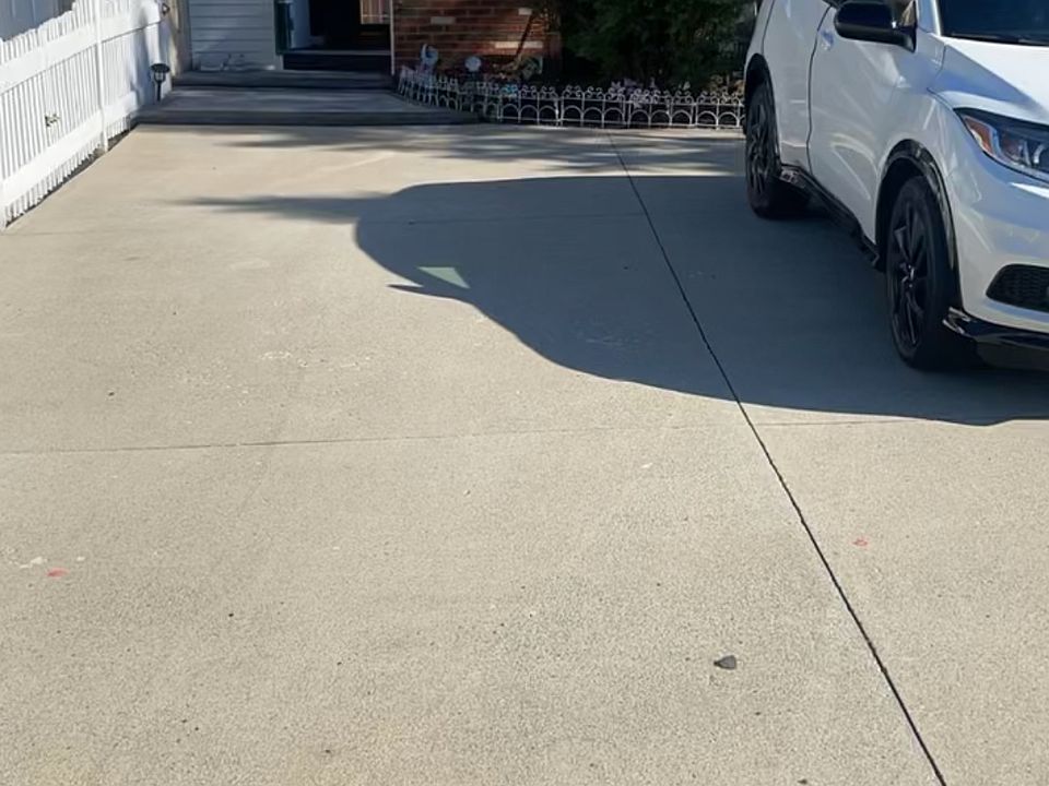 Front of house, driveway.