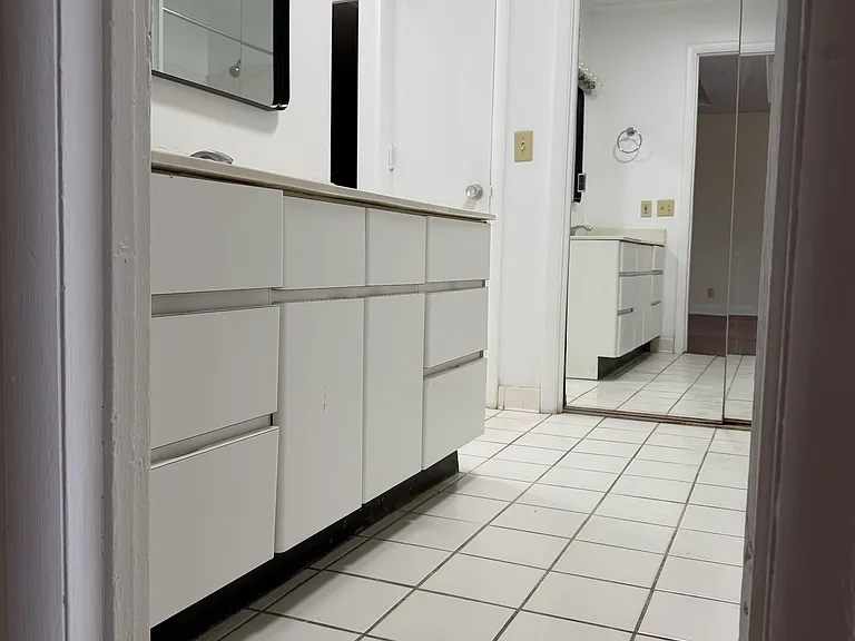 Huge bathroom with tub & shower. Absolutely wonderful lighting. 2 closets with sliding mirror doors.