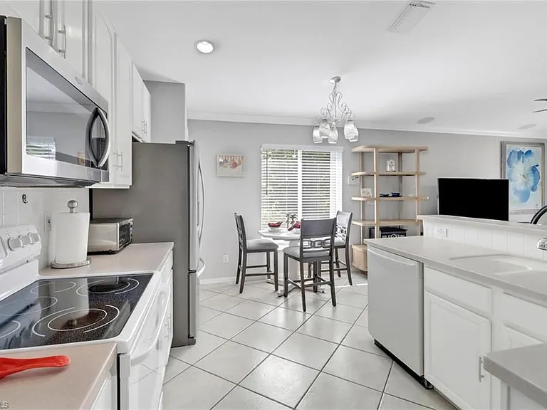 7477 Lourdes Ct — Photo 11