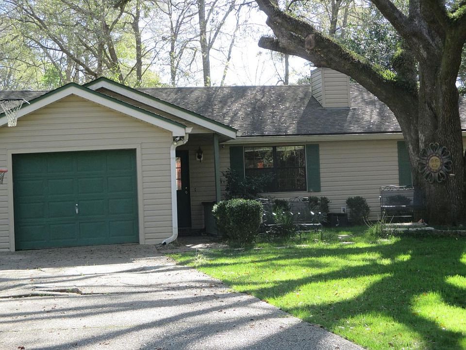 The Green Goddess: Beautifully groomed live oak to shade, shelter, and invite you and guests in the home.