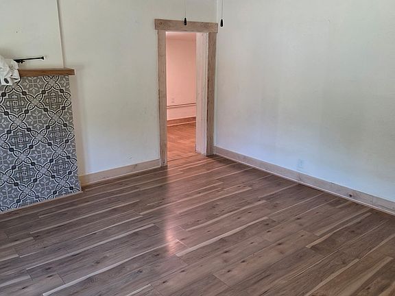 Living room leading to mud room and front door.