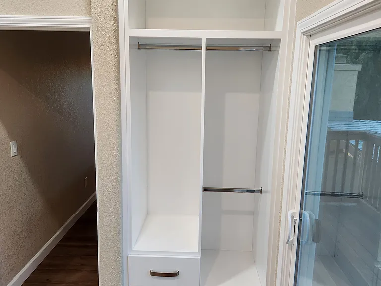 Built-in closet for master bedroom and sliding door to balcony.