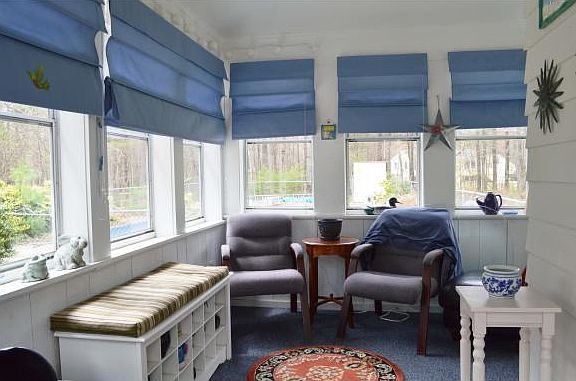 Covered Porch overlooking pool