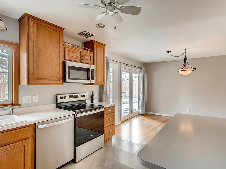 Kitchen with new appliances - stove, microwave, dishwasher, refrigerator