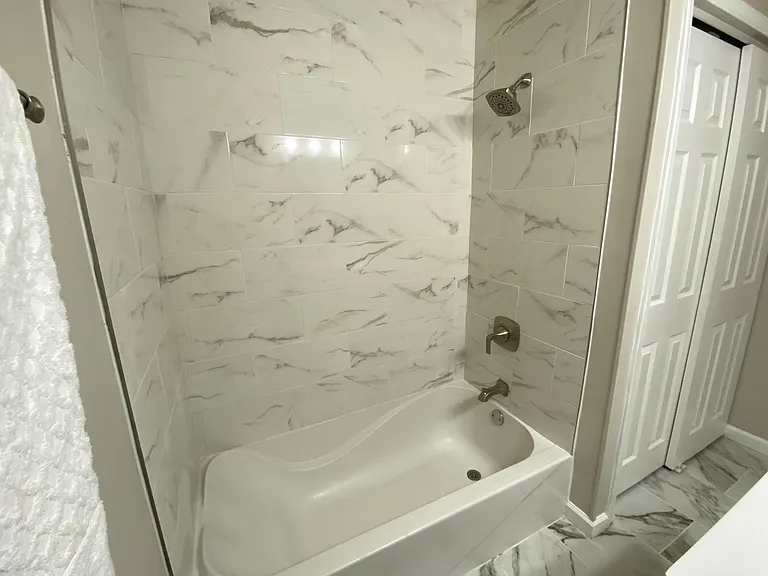 Beautiful ceramic and new faucets in the bathtub.