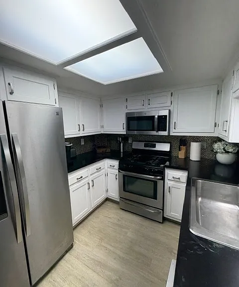 kitchen, dining room area behind it