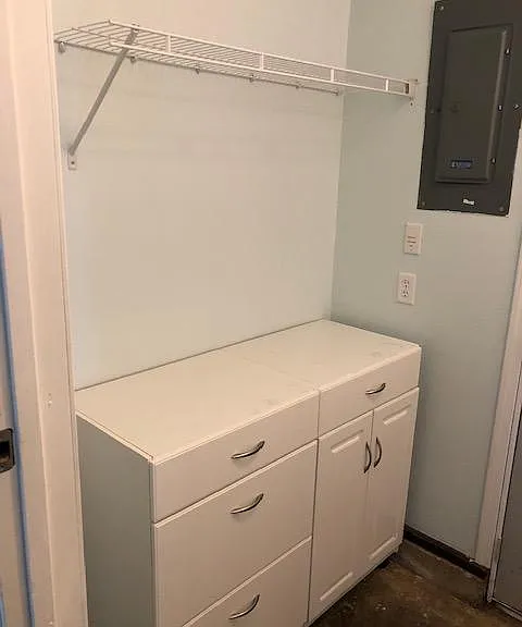 This can be used as a folding table and more cabinets!