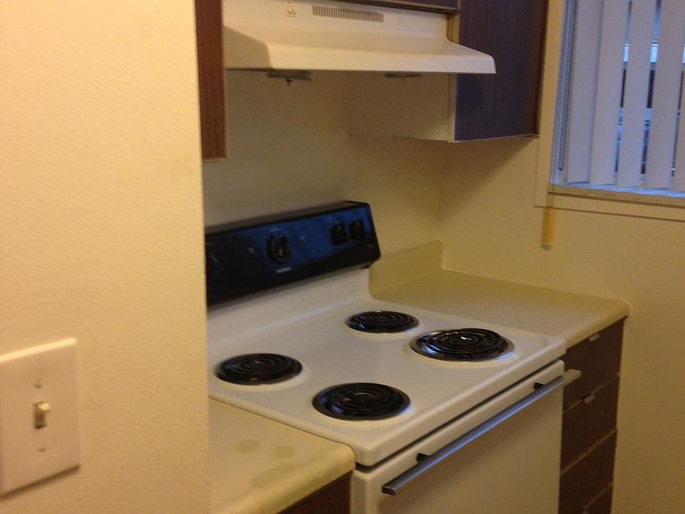 Cabinet and flooring styles may vary.