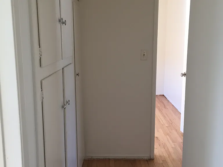 Hallway connecting bedrooms to bathroom