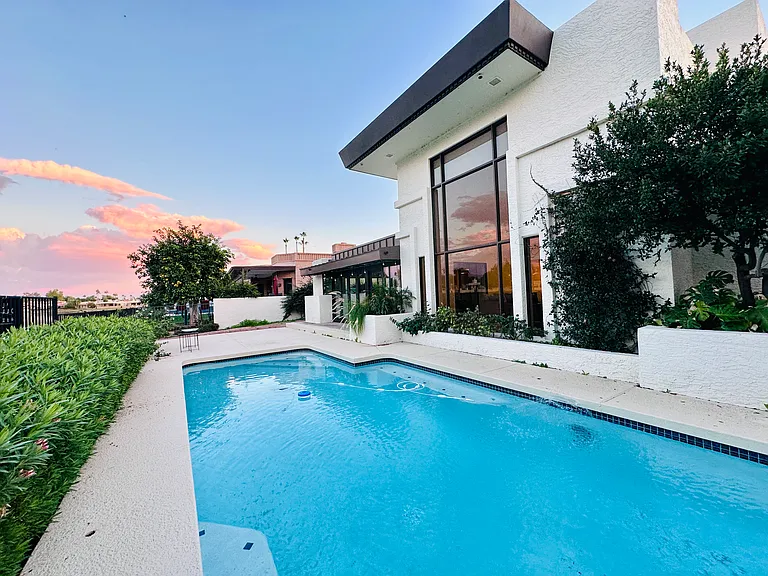 Backyard of the house with swimming pool.