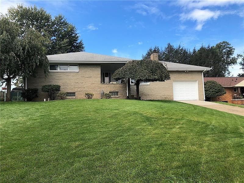 Front. Welcome to 999 Olga Street, a wonderful brick ranch in a desirable neighborhood.