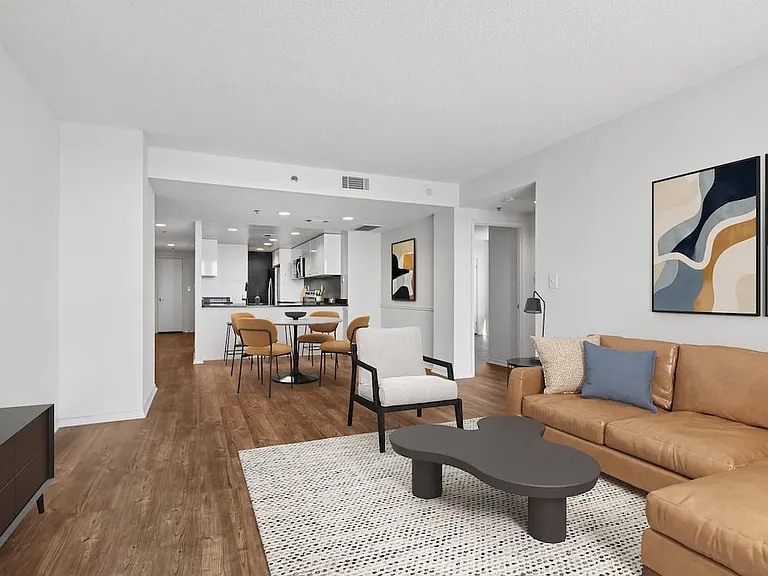 Renovated Package I living and dining area with hard surface flooring