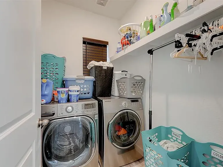 A dedicated laundry room (washer and dryer do not come with the property). Gas and electric hookups