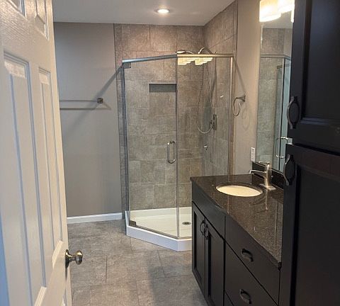 Master bath with beautifully tiled shower and walk in closet.