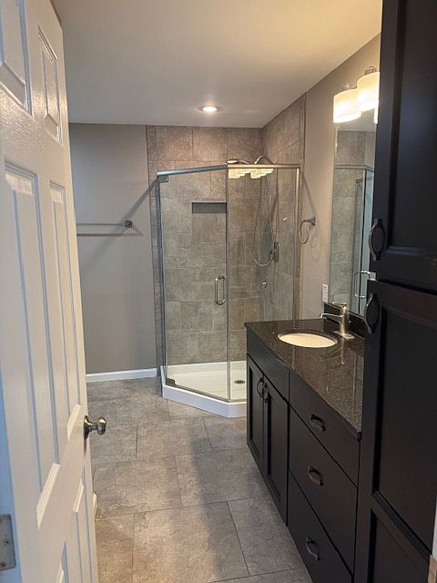 Master bath with beautifully tiled shower and walk in closet.