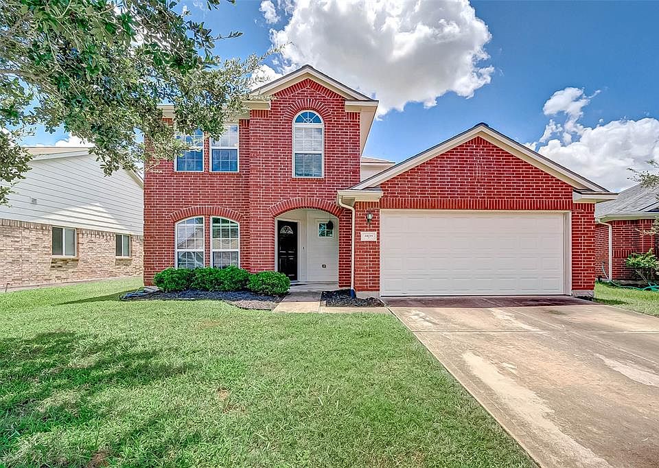 Charming 2-story home with attractive brick elevation and gabled roofing. 2-car garage with double wide driveway offering additional space for guests and family.