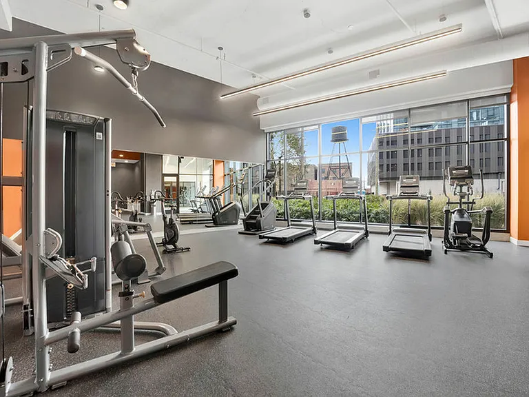Fitness Center Featuring Free Weights and Exercise Equipment