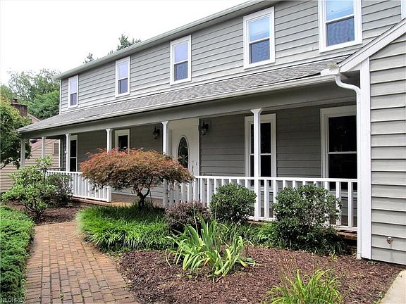 Attractive and inviting front porch overlooking the lovely neighborhood.