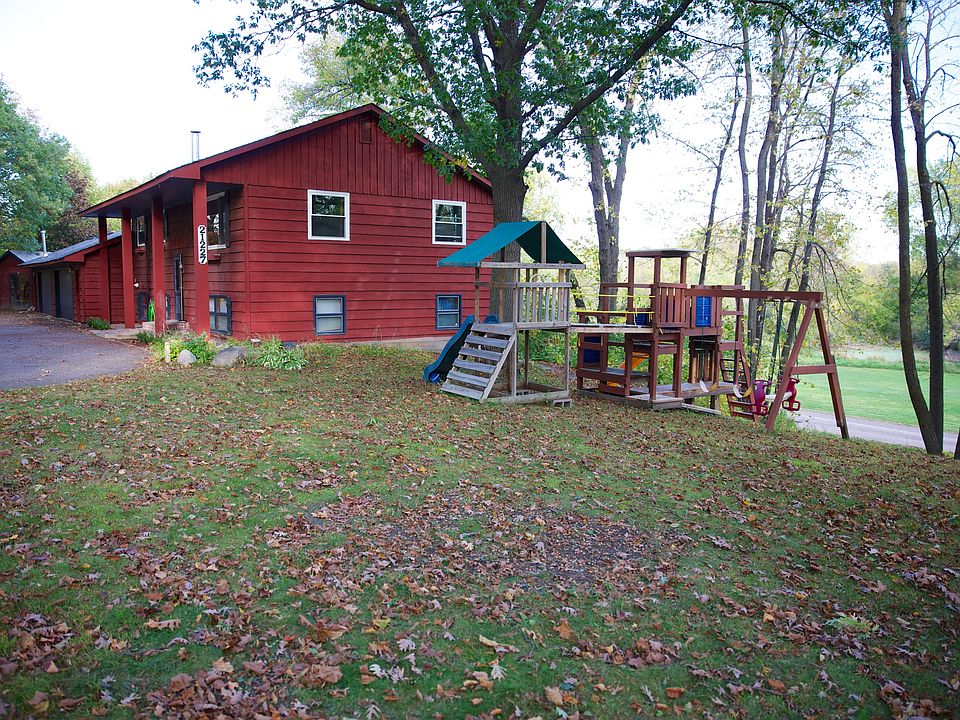 house & swingset from yard