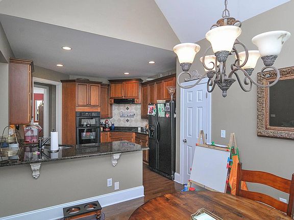 kitchen with custom cabinetry and breakfast area