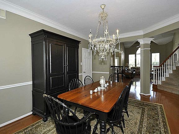 The formal dining room is located to the left off the entry and features crown molding and hardwood 