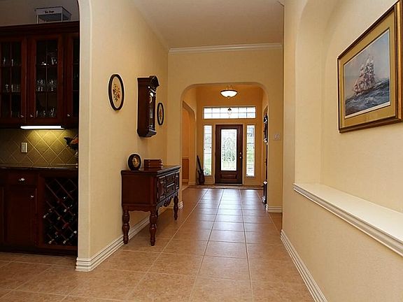 The large entry hall has art niches.