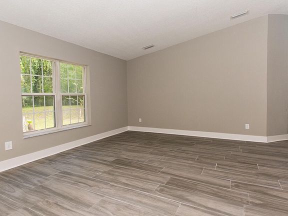 Large plank tile flooring.