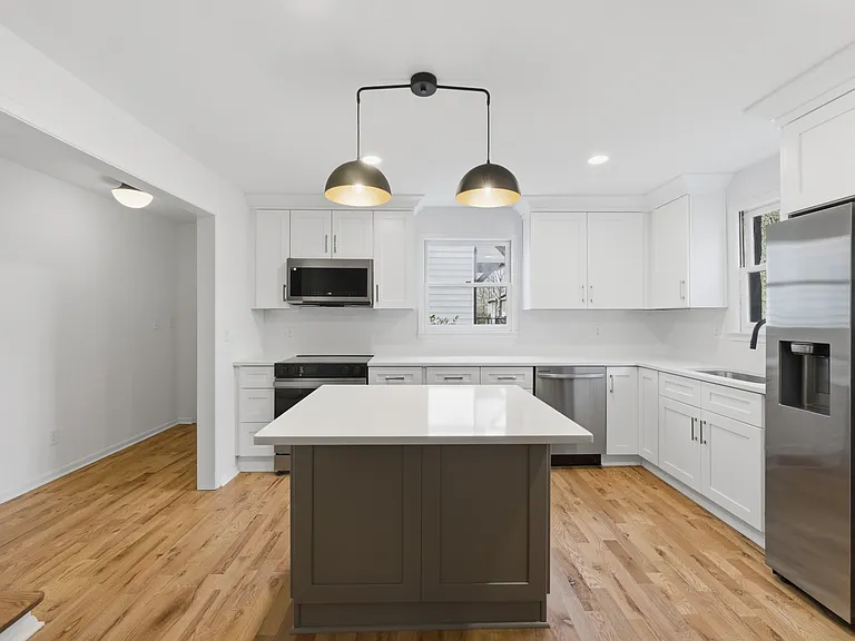 Brand new stainless steel appliances and custom cabinetry