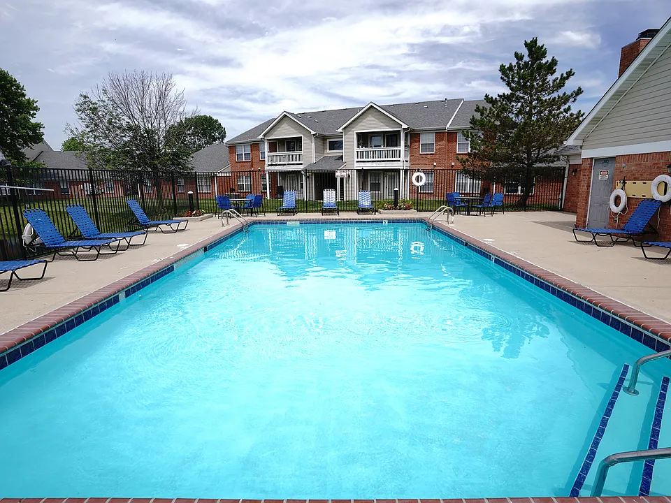 A refreshing escape just steps from home _ Hamilton Station's pool area features a spacious sundeck, plenty of lounge chairs, and scenic views of the community's apartment buildings.