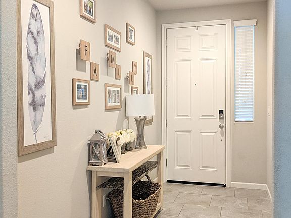 Spacious entry has access to the second garage. Large enough for an entry table and bench(es).