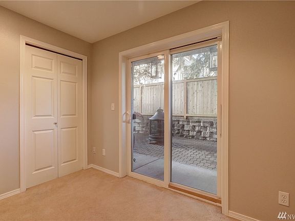 Lower level guest bedroom / entertainment room has access to the private patio through sliding glass doors.