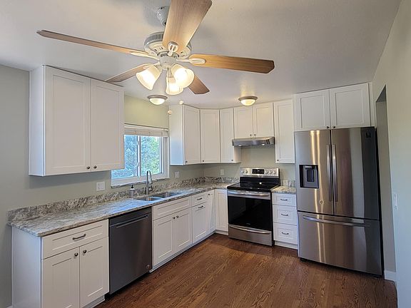 Hardwood floors, granite counters, softclose drawers, pull-out trash bin, Samsung fridge, GE oven, Whirlpool dishwasher