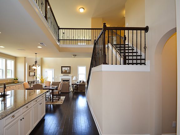 winding stairs w/ iron rails