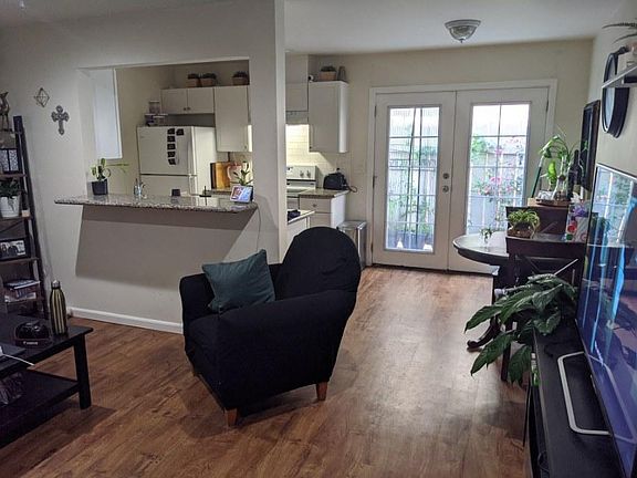 Living room with double doors opening to your outside private patio