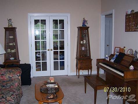 Formal living with french doors to Office