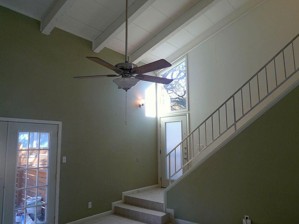 There are vaulted ceilings in the living room. The French doors open to a dec in the private, fenced in yard.