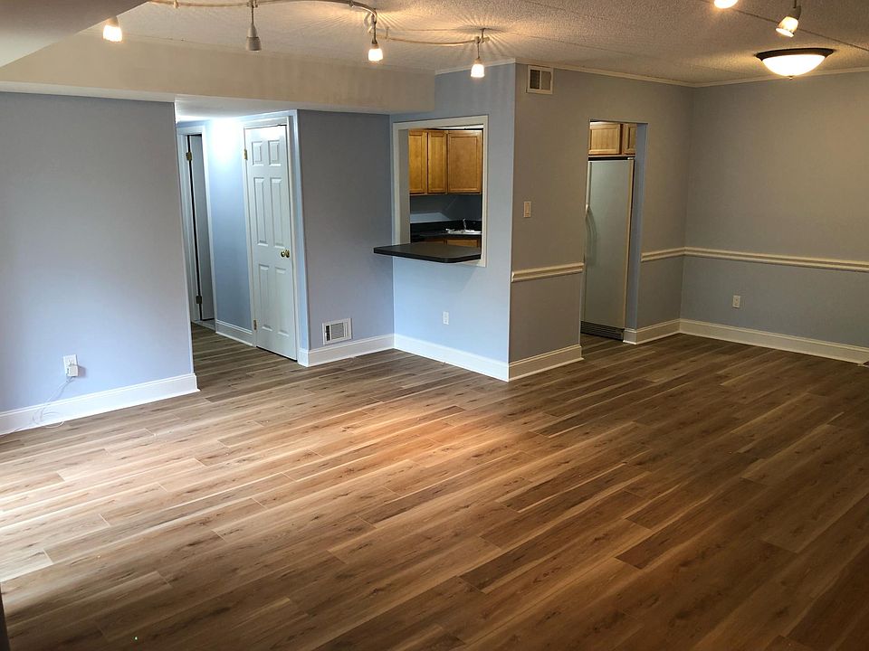 Family room with kitchen in background.