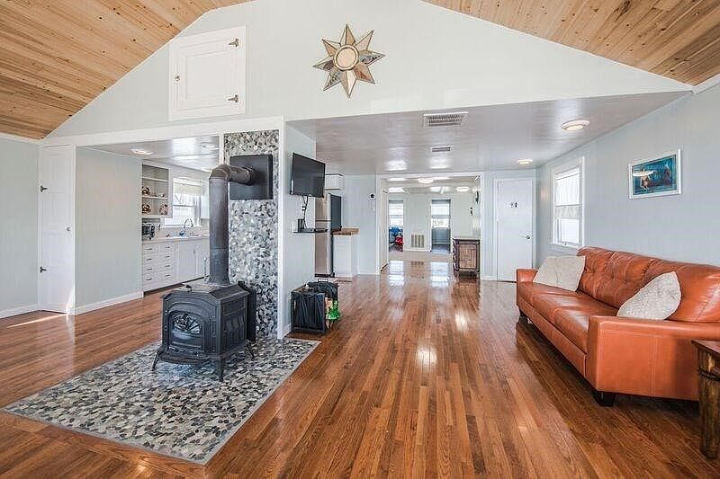 Beautiful hardwoods, liv rm to kit and den. Wood burning stove helps keep you warm