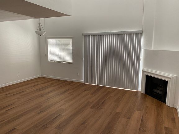 living, dining area with gas fireplace