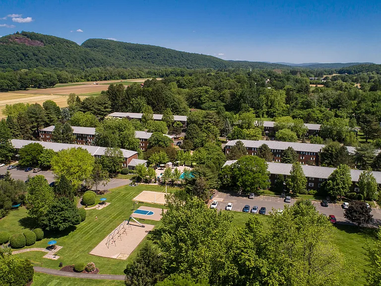 Marvel at an aerial view of our expansive 22-acre Sugarloaf Estates, nestled among natural beauty.